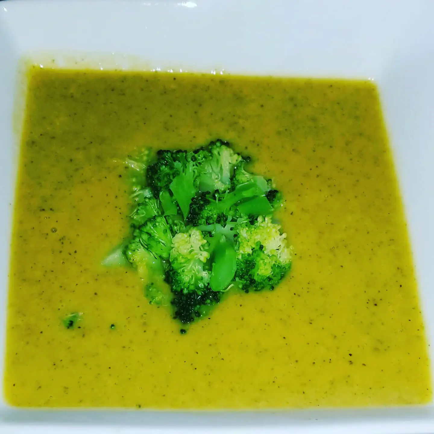 A healthy soup with fresh broccoli in a bowl