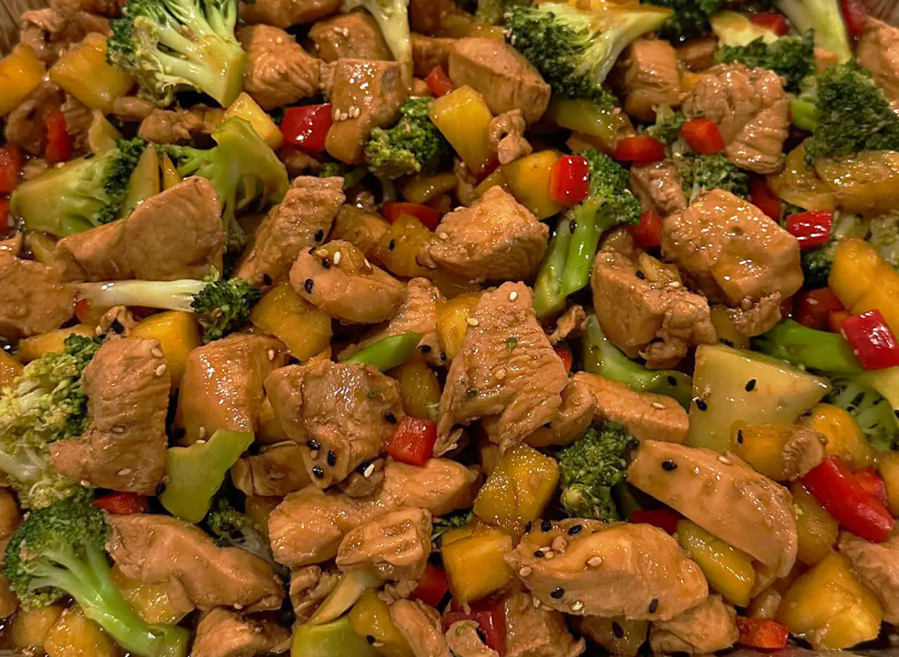 A delicious plate of stir-fried chicken teriyaki and veggies, bursting with flavors and vibrant colors