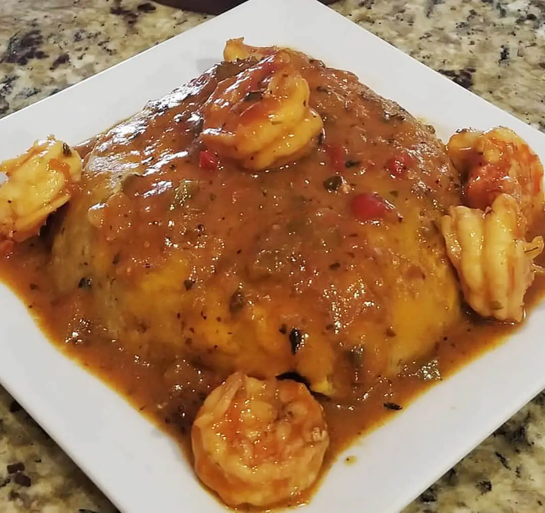 Mashed garlic plantain served with shrimps in a salsa criolla sauce.
